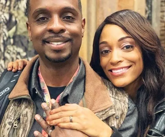 Henry and Lakeisha Woodard hug each other as the pose for the camera